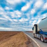 Truck on the road through countryside